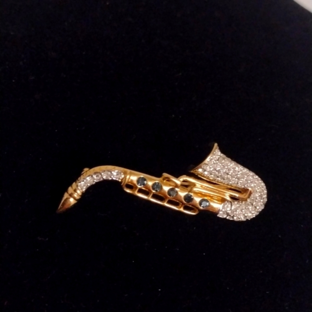 saxophone music brooch marked AFJ gold tone with rhinestones